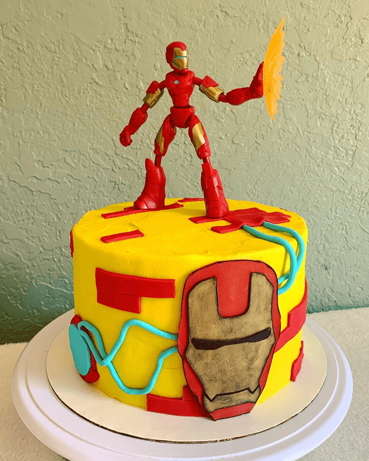 Iron Man Cake with Iron Man Toy on Top and Red Yellow Blue Base